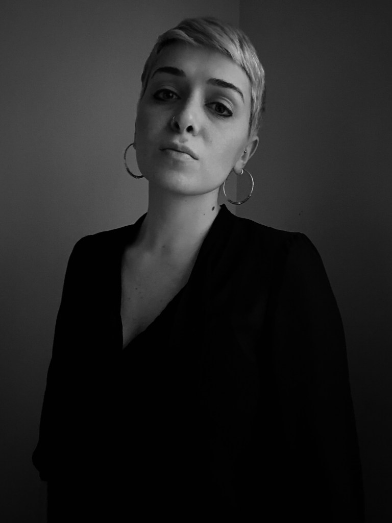 Sara Aridi, white and black